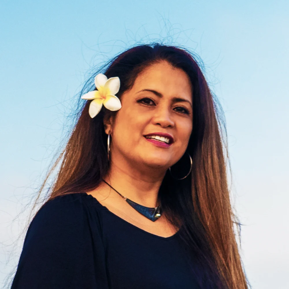 Lynne, co-owner of Sweet Aloha Ice Cream, with a plumeria flower in her hair